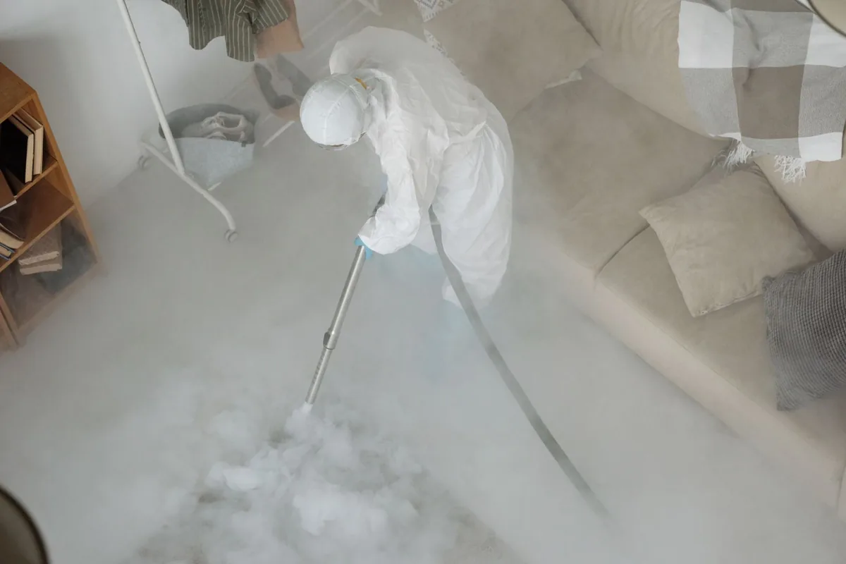 Biohazard cleanup technician in protective equipment, Champlin, MN